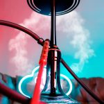 Colorful still life of a hookah with neon lights and smoke.